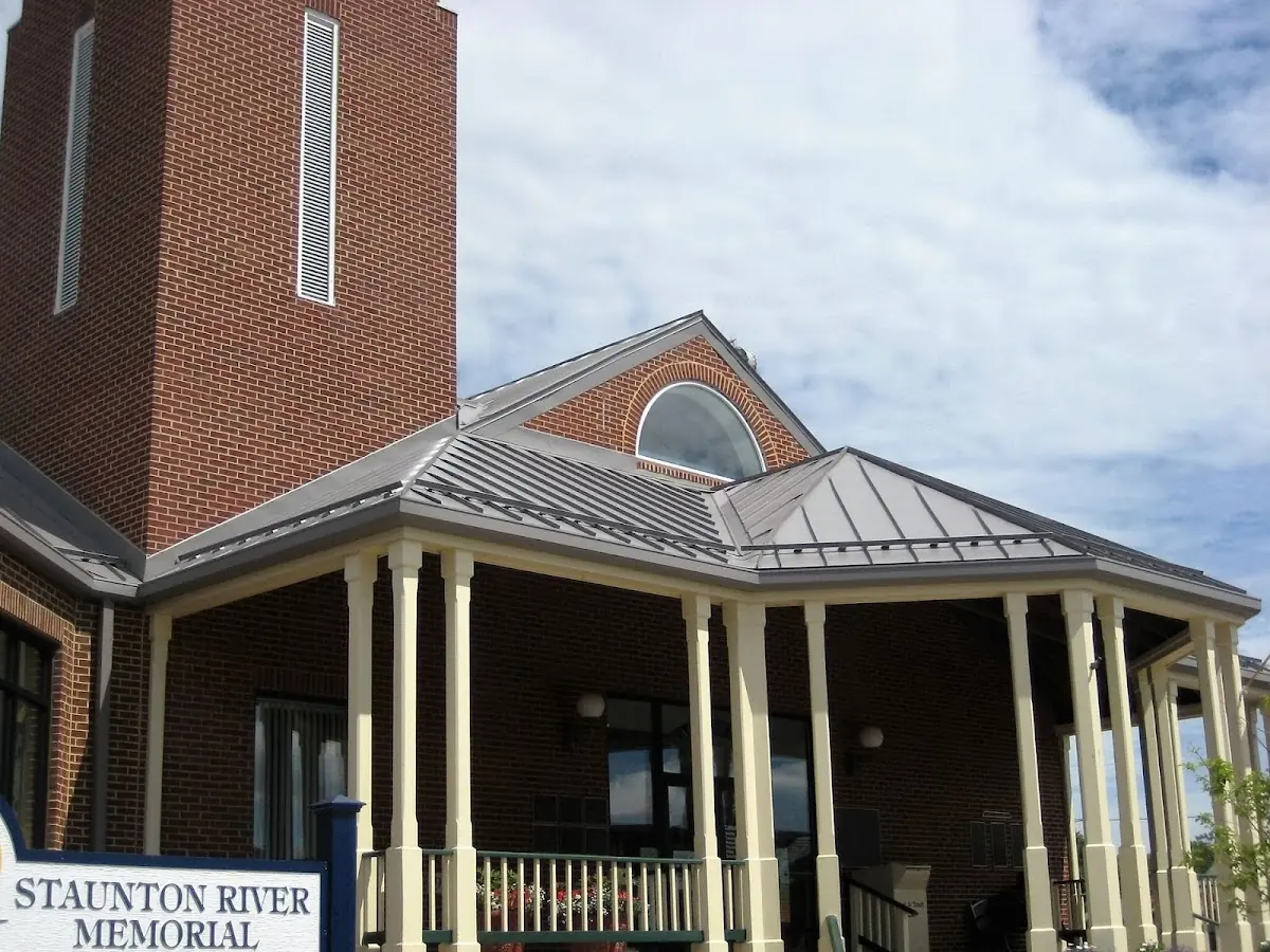 Skilled roofing craftsmen working on a residential roof in Foley